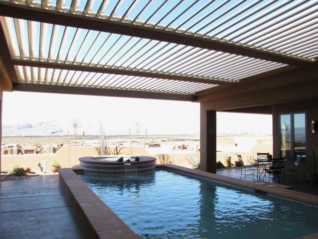 equinox louvered roof covering pool