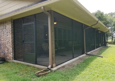 long screened in patio with two doors