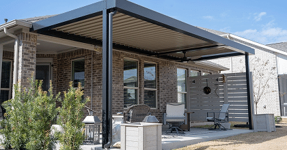 Luxurious outdoor lounge with turquoise seating and modern pergolas surrounding a rectangular pool.